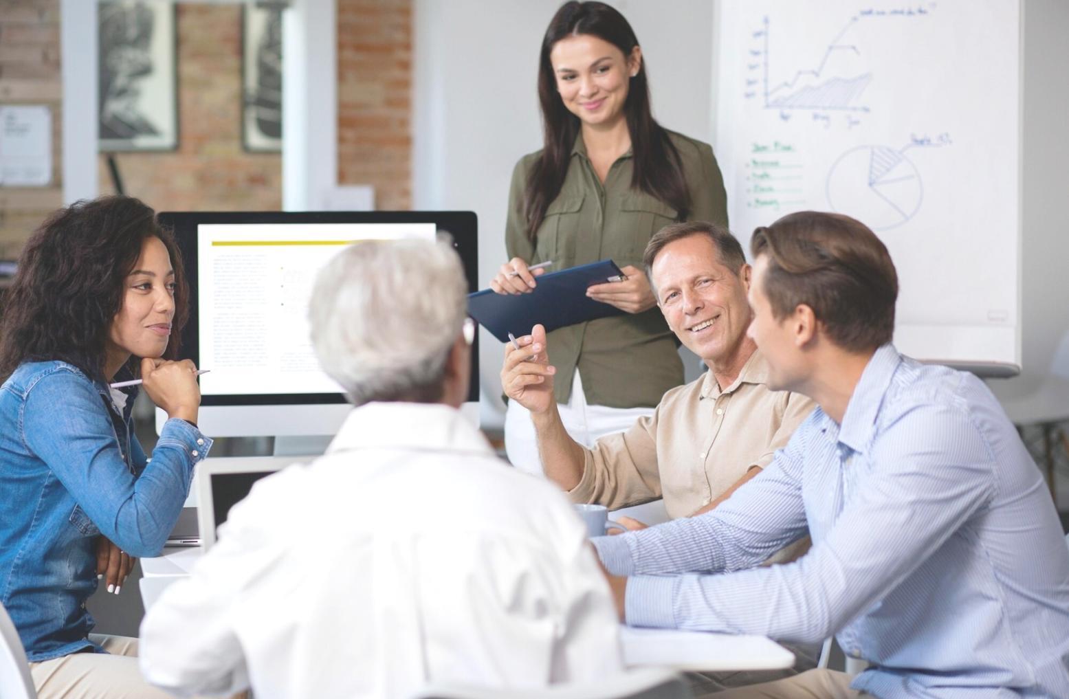 Business team reviewing rolling budget projections and financial forecasts